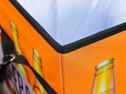 ebuy24 Cajas de almacenamiento Fabo, bolsa refrigeradora, taburete, con tapa, negro, blanco, naranja.
