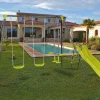 Habitat et jardin Columpio metálico "Enzo II" con tobogán - 4 aparatos - Verde